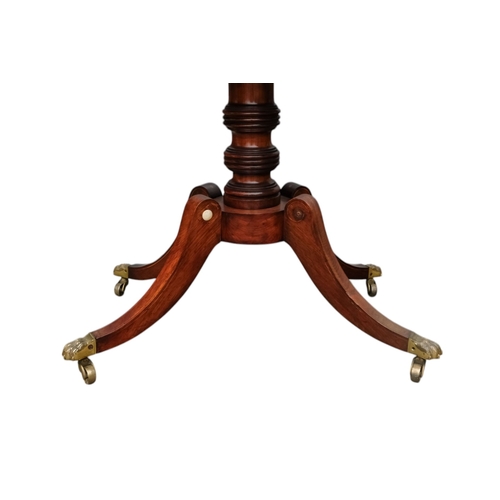 934 - A George IV rosewood card table - the rectangular top with canted corners, on a turned support and p... 