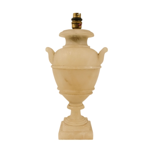 16 - A pair of early 20th century alabaster table lamps - of urn form with twin handles and raised on a s... 