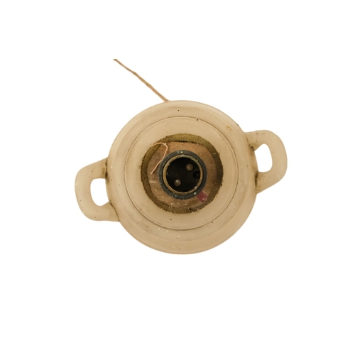 16 - A pair of early 20th century alabaster table lamps - of urn form with twin handles and raised on a s... 