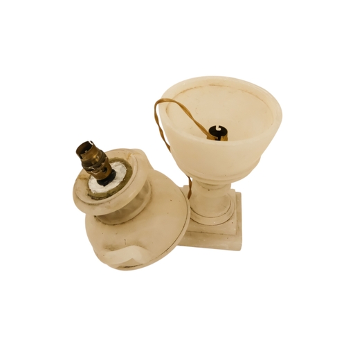 16 - A pair of early 20th century alabaster table lamps - of urn form with twin handles and raised on a s... 