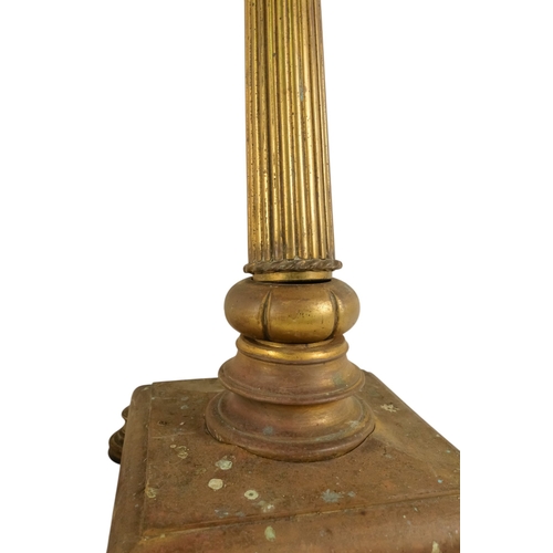 18 - A pair of brass adjustable standard lamps - with reeded columns and square bases on bun feet. (2)
