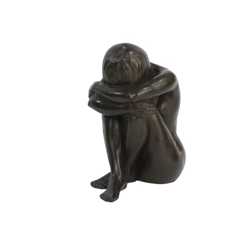 22 - A 20th century cold cast bronze of a seated nude - hunched, signed with initials and dated, 19cm hig... 