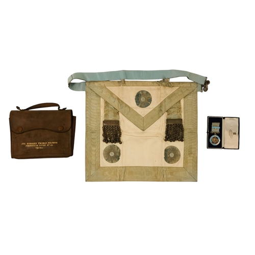 27 - A masonic apron - together with silver and enamel jewel, presented with brown leather pouch.