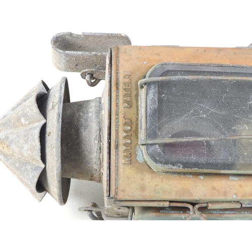 29 - A 19th century Raydyot zinc and brass carriage lamp - with two caged rectangular glass panels  and a... 