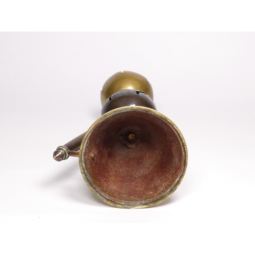 37 - An Arts & Crafts brass and copper candlestick - probably Dr Christopher Dresser by Benham & Froud, w... 