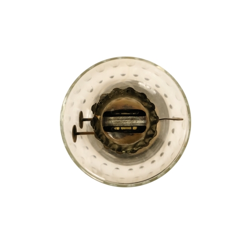 40 - A late Victorian oil lamp - with a flash-cut clear glass reservoir on a repousse brass support and c... 