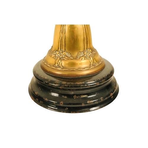 40 - A late Victorian oil lamp - with a flash-cut clear glass reservoir on a repousse brass support and c... 