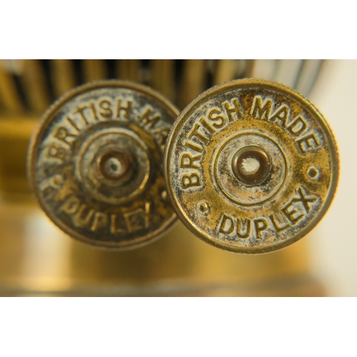 40 - A late Victorian oil lamp - with a flash-cut clear glass reservoir on a repousse brass support and c... 