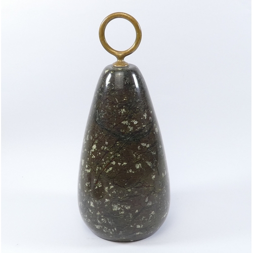 41 - A serpentine door stop - of teardrop form with a ring handle, 28cm high.