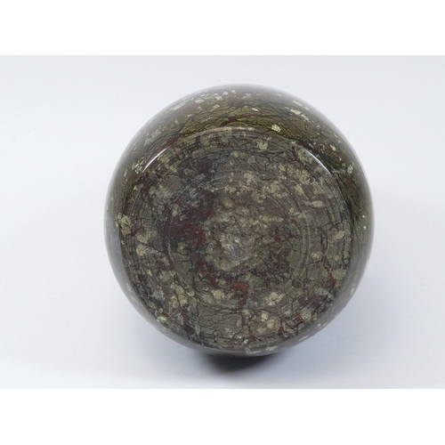 41 - A serpentine door stop - of teardrop form with a ring handle, 28cm high.