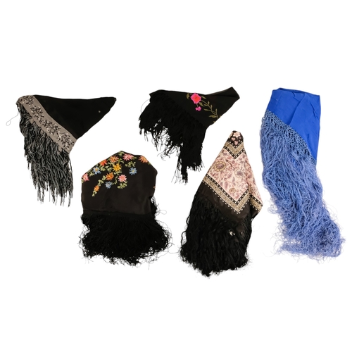 45 - An early 20th century black piano shawl - embroidered with flowers with a long fringe, together with... 