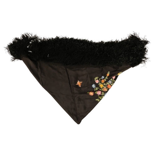 45 - An early 20th century black piano shawl - embroidered with flowers with a long fringe, together with... 