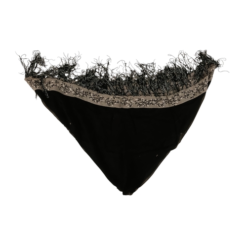 45 - An early 20th century black piano shawl - embroidered with flowers with a long fringe, together with... 