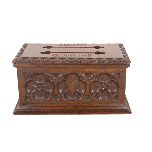46 - A late 19th century oak Gothic style postal box - of rectangular form with slots for answered and un... 