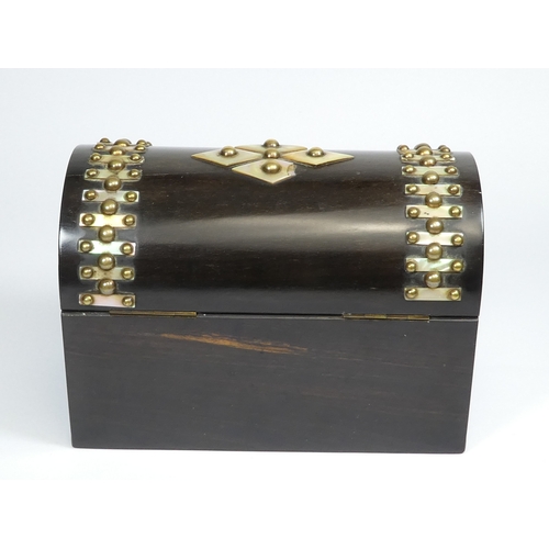 49 - A late Victorian coromandel stationery casket - with a domed cover and set with brass studs and moth... 
