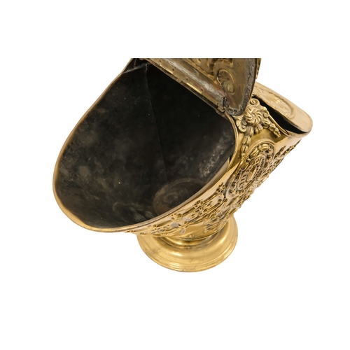 5 - A late 19th/early 20th century brass coal scuttle - oval with twin covers repousse decorated with fo... 