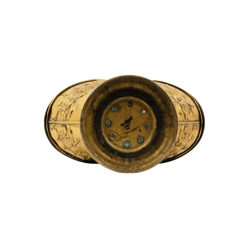 5 - A late 19th/early 20th century brass coal scuttle - oval with twin covers repousse decorated with fo... 