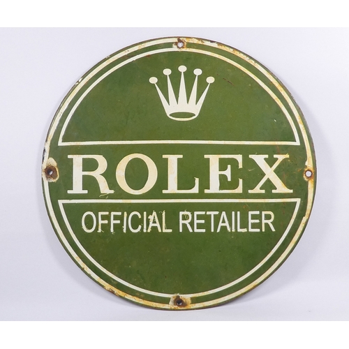 54 - A mid 20th century enamel Rolex retailer sign - circular with white corporate text on a green ground... 