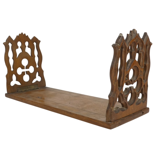 6 - A 19th century oak book slide - with hinged Gothic end-supports, 33 x 13cm (57cm extended).