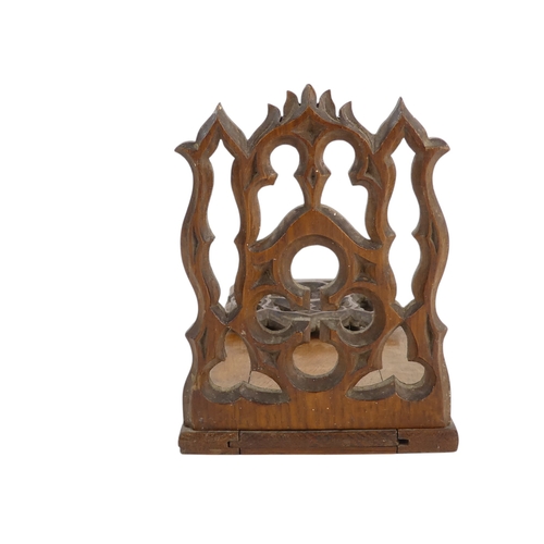 6 - A 19th century oak book slide - with hinged Gothic end-supports, 33 x 13cm (57cm extended).