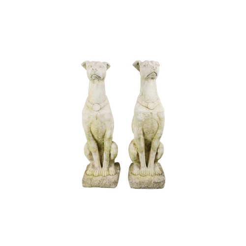 60 - A pair of large reconstituted stone gate capitals - modelled as greyhounds, 76cm high. (2)