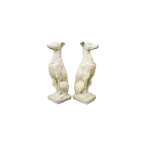 60 - A pair of large reconstituted stone gate capitals - modelled as greyhounds, 76cm high. (2)