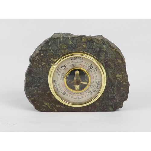 7 - A 20th century serpentine mounted barometer - polished with a rough textured outer edge, 12cm high, ... 