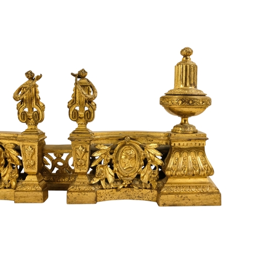 8 - A set of French 19th century gilt metal chenets - together with fender rail, the chenets with classi... 