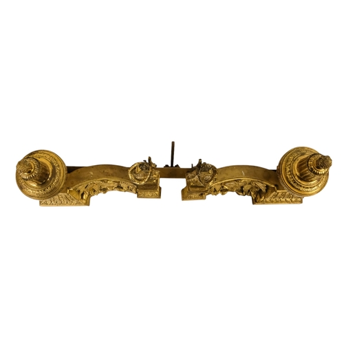8 - A set of French 19th century gilt metal chenets - together with fender rail, the chenets with classi... 