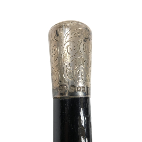 9 - An ebonised baton - London 1927, with silver foliate engraved mounts including presentation inscript... 