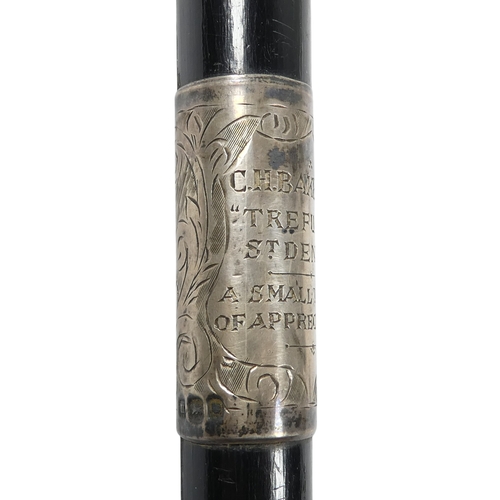 9 - An ebonised baton - London 1927, with silver foliate engraved mounts including presentation inscript... 