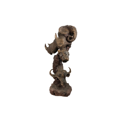 35 - A 20th century African sculpture of The Big Five - probably Zimbabwe ironwood, 90cm high.
