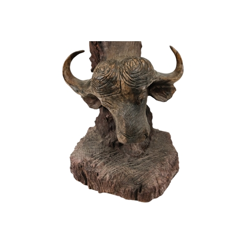 35 - A 20th century African sculpture of The Big Five - probably Zimbabwe ironwood, 90cm high.
