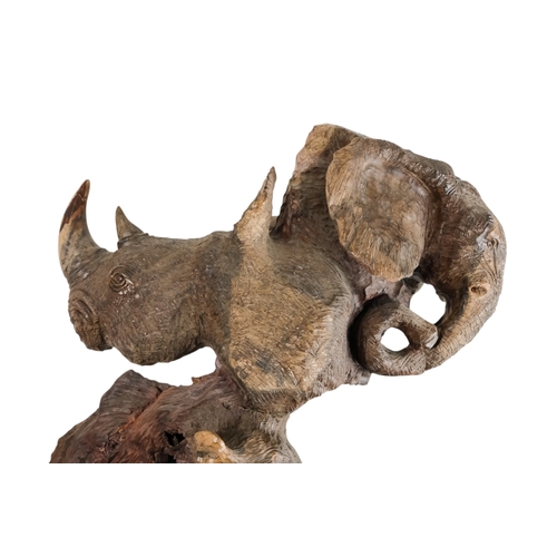 35 - A 20th century African sculpture of The Big Five - probably Zimbabwe ironwood, 90cm high.