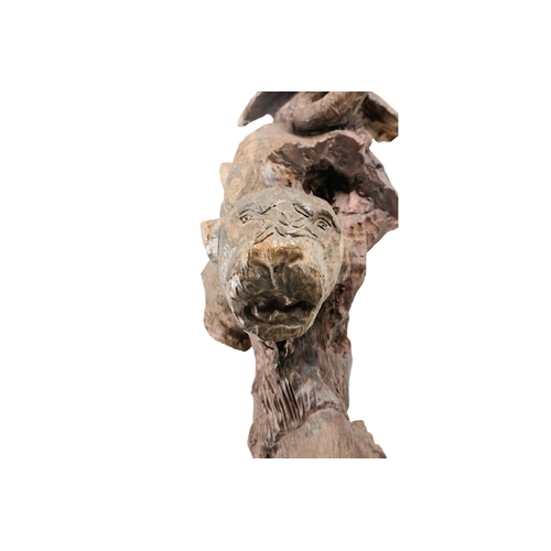 35 - A 20th century African sculpture of The Big Five - probably Zimbabwe ironwood, 90cm high.