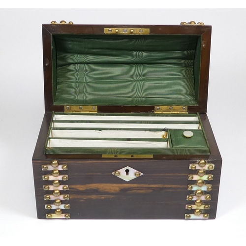 43 - A late Victorian coromandel stationery casket - with a domed cover and set with brass studs and moth... 