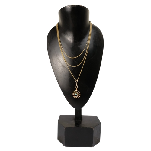 604 - A yellow metal fine curb link chain - together with a 9ct circular pendant, 140cm long, 20g.