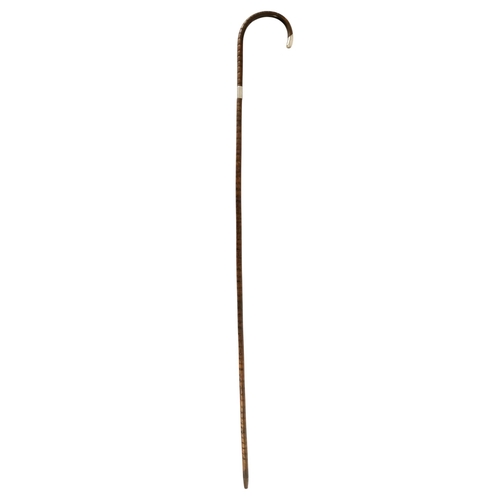 86 - An early 20th century partridge wood walking cane - Chester 1913, with silver mounts and modelled as... 