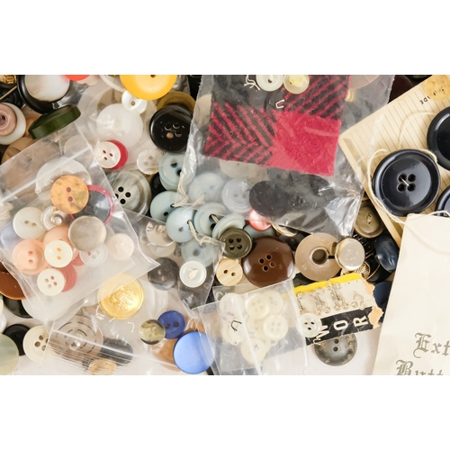92 - A quantity of 20th century buttons.