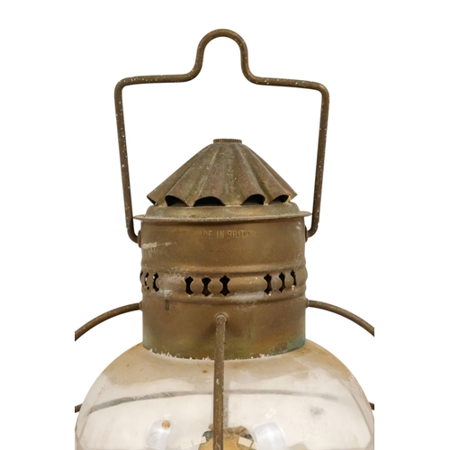 102 - An early 20th century brass anchor light - with clear glass, 32cm high.