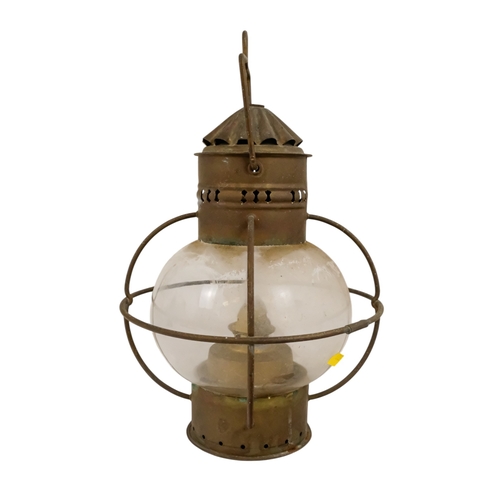 102 - An early 20th century brass anchor light - with clear glass, 32cm high.