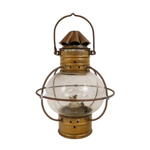 103 - An early 20th century brass anchor light - with clear glass, 32cm high.