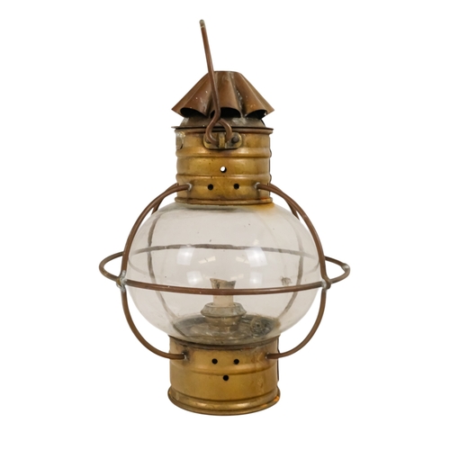103 - An early 20th century brass anchor light - with clear glass, 32cm high.