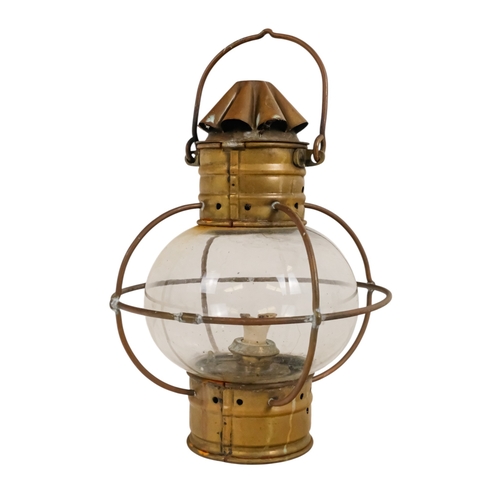 103 - An early 20th century brass anchor light - with clear glass, 32cm high.