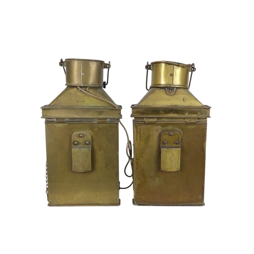 106 - A pair of brass ships lamps - of faceted form with flat backs, 41cm high.