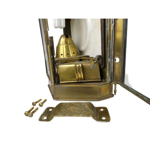 106 - A pair of brass ships lamps - of faceted form with flat backs, 41cm high.