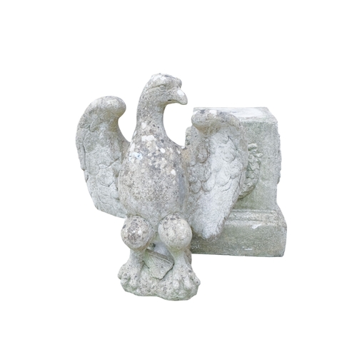 110A - A reconstituted stone eagle - with wings outstretched, height 56cm, width 45cm, raised on a plinth d... 