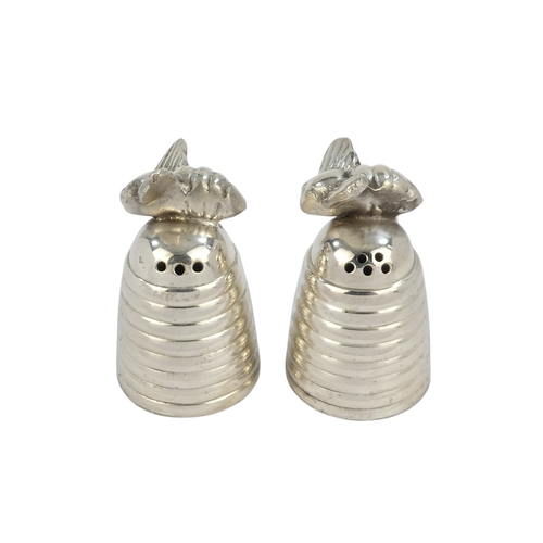 114 - A pair of white metal salts - decorated with bees, height 6cm (lack screw bases).
