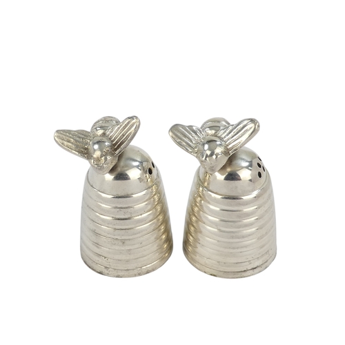114 - A pair of white metal salts - decorated with bees, height 6cm (lack screw bases).
