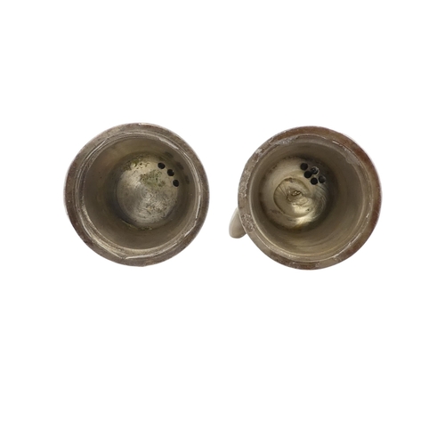 114 - A pair of white metal salts - decorated with bees, height 6cm (lack screw bases).